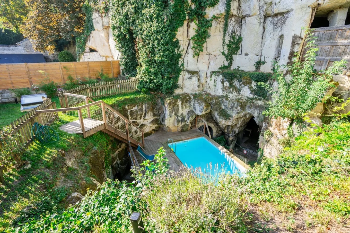 View down onto the pool carved into the tufa rock and the hanging garden, Logis Escale