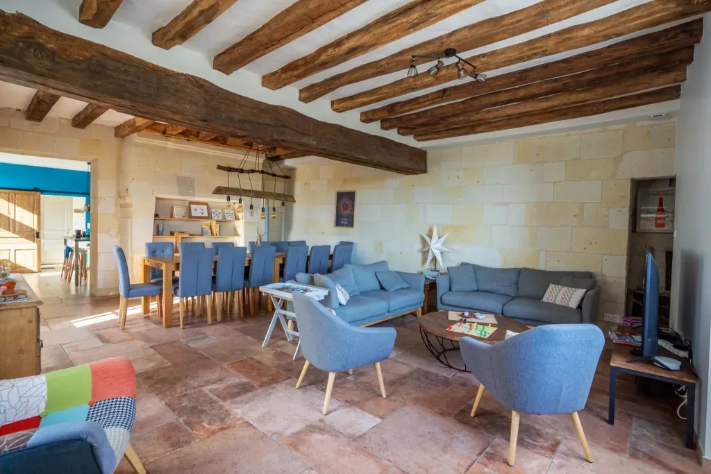 Large living room with exposed beams, tufa stone walls and a table for 15, Logis Escale