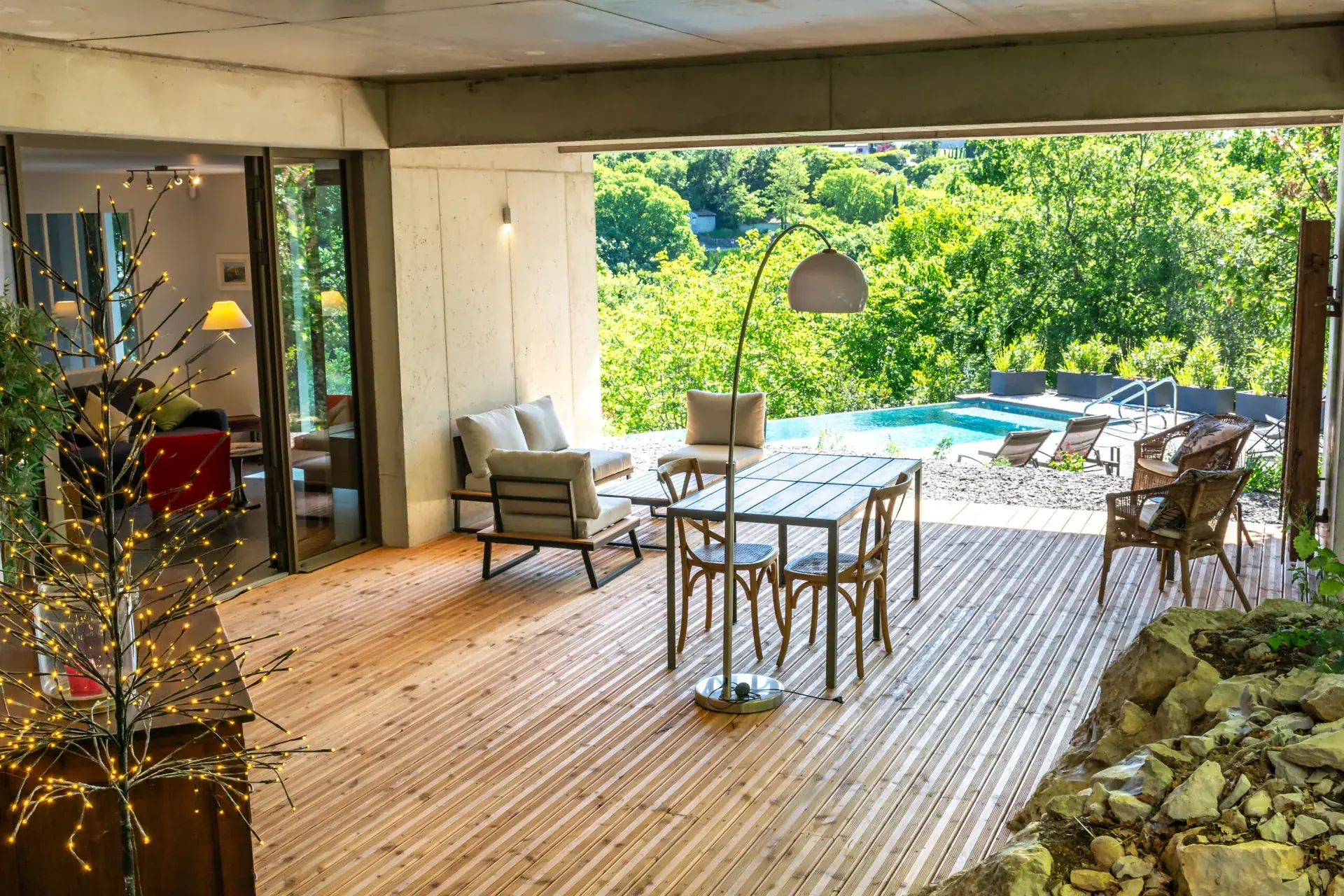 Covered terrace of the gîte opening onto the garden and infinity pool, Maison Chassel